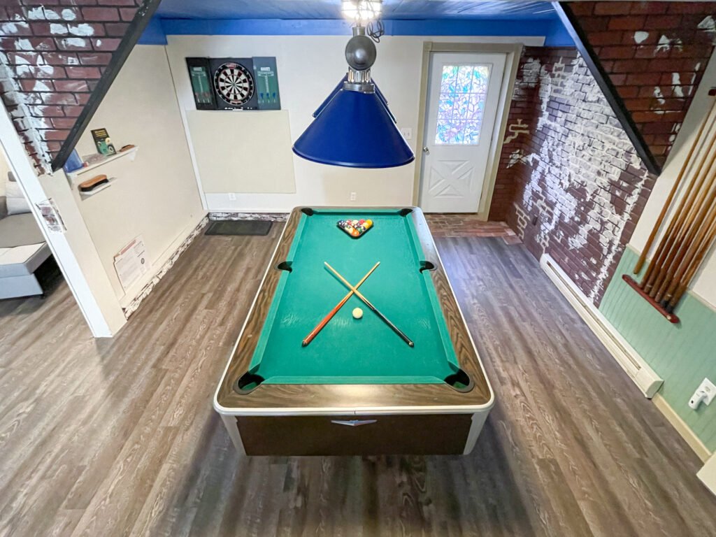 The billiards table, located on the lower level of the Quiet Pond Lookout vacation rental.