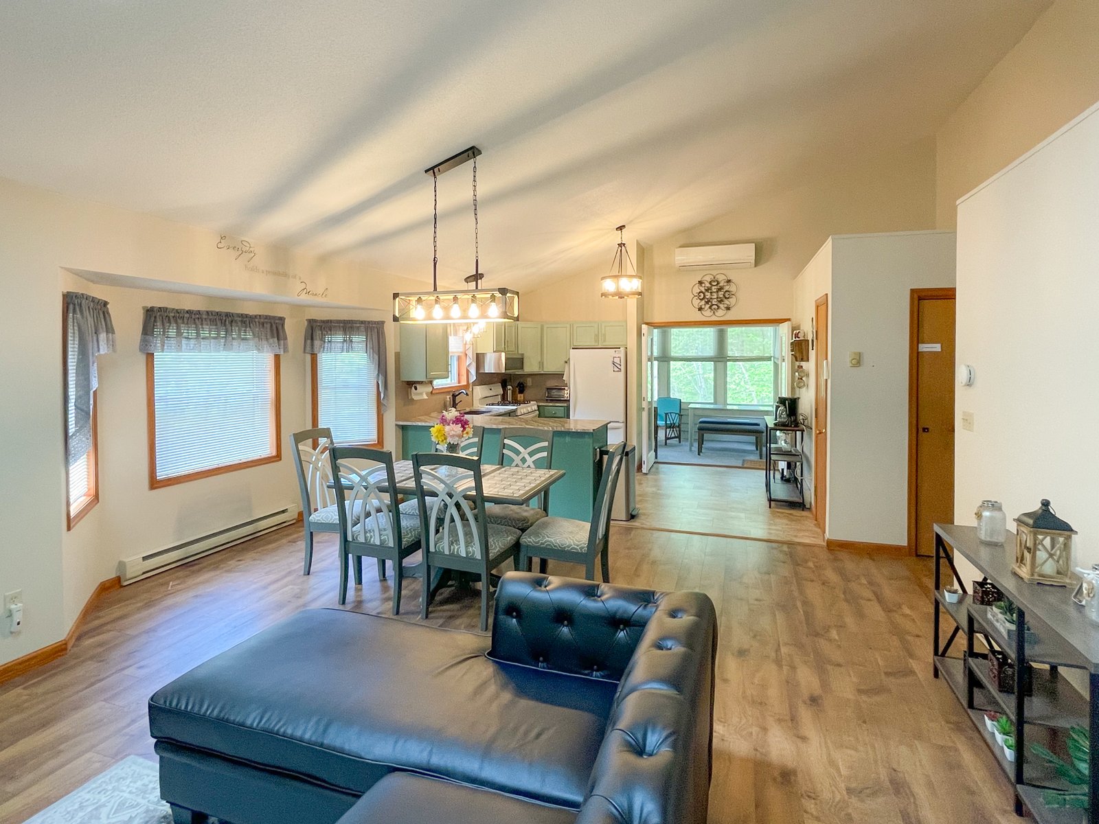 Living room and kitchen view of Quiet Pond Lookout rental property